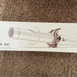 T3 Auto rotating curling iron. 1.25”. In original box. Used once.